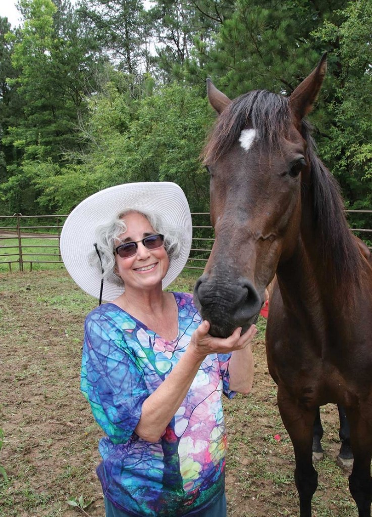 With Foxy, a rescue thoroughbred
